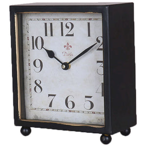 Black and gold mantle clock with feet