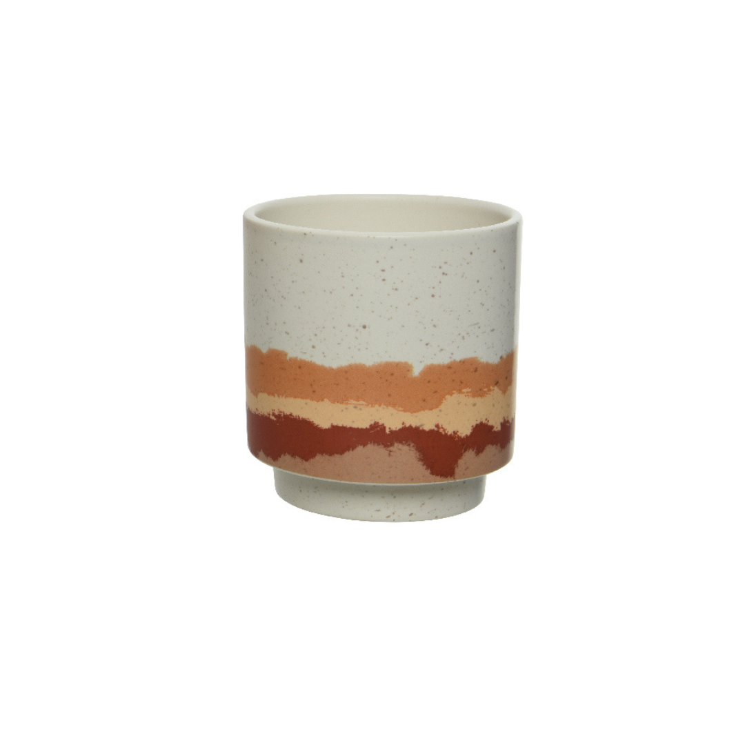 Speckled planter with coloured waves
