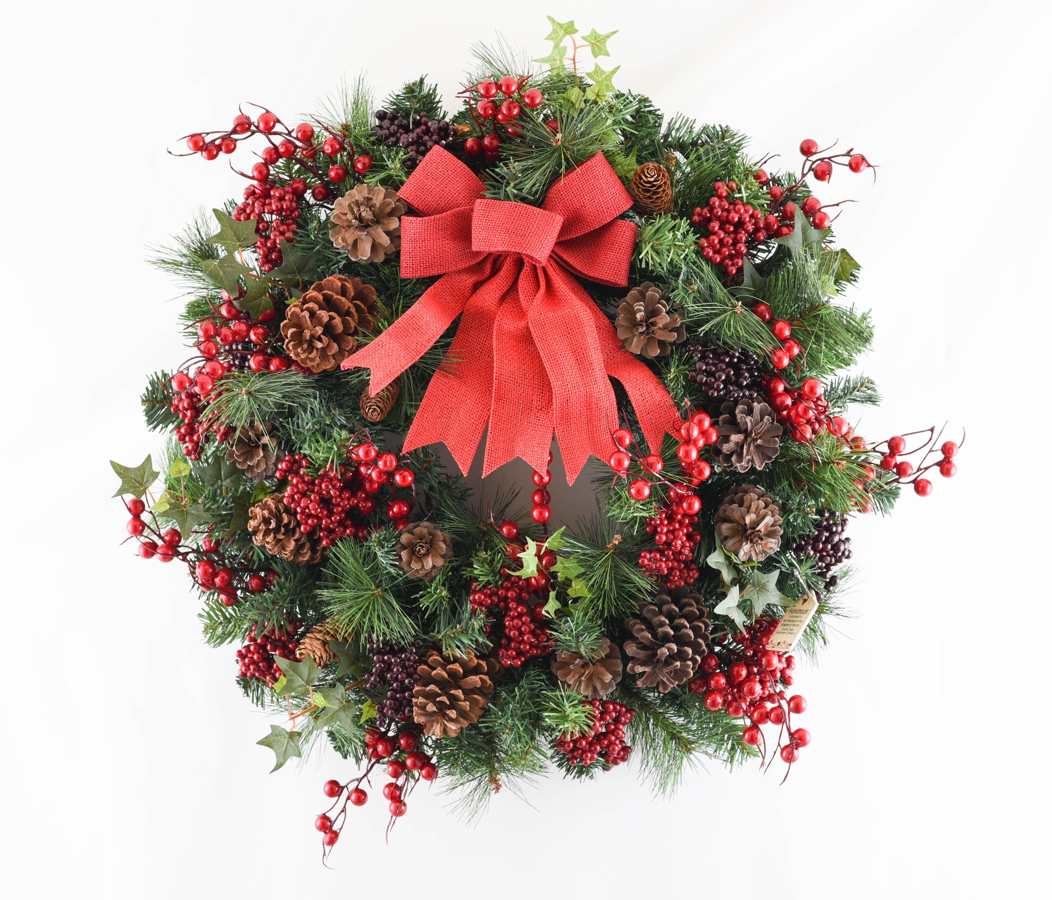 Traditional Christmas wreath with red berries and bow - large