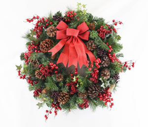 Traditional Christmas wreath with red berries and bow - large